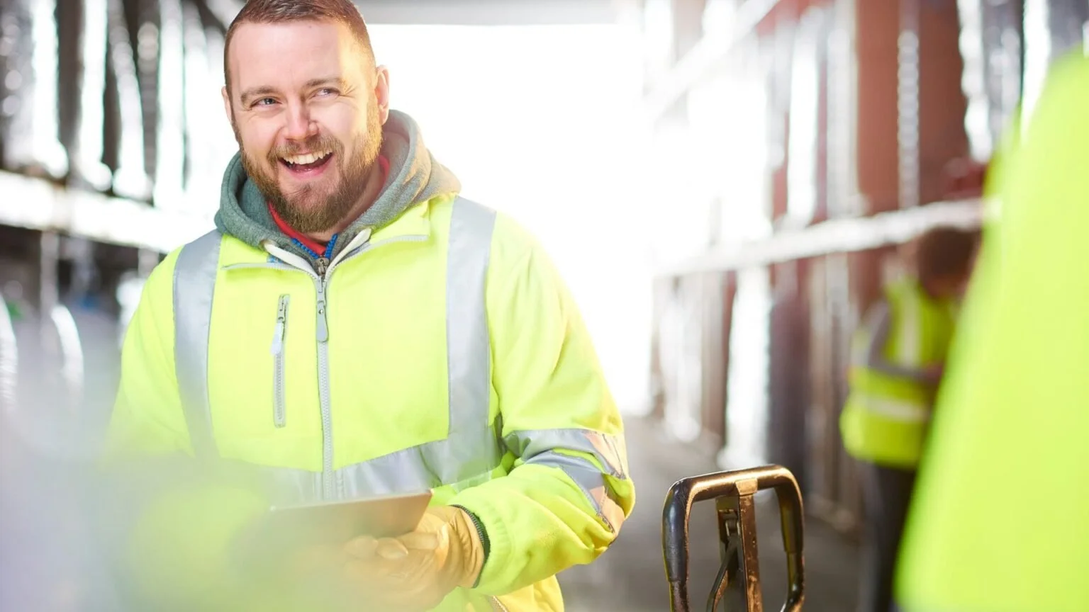 Upwood Distribution warehouse team member checking stock on a tablet